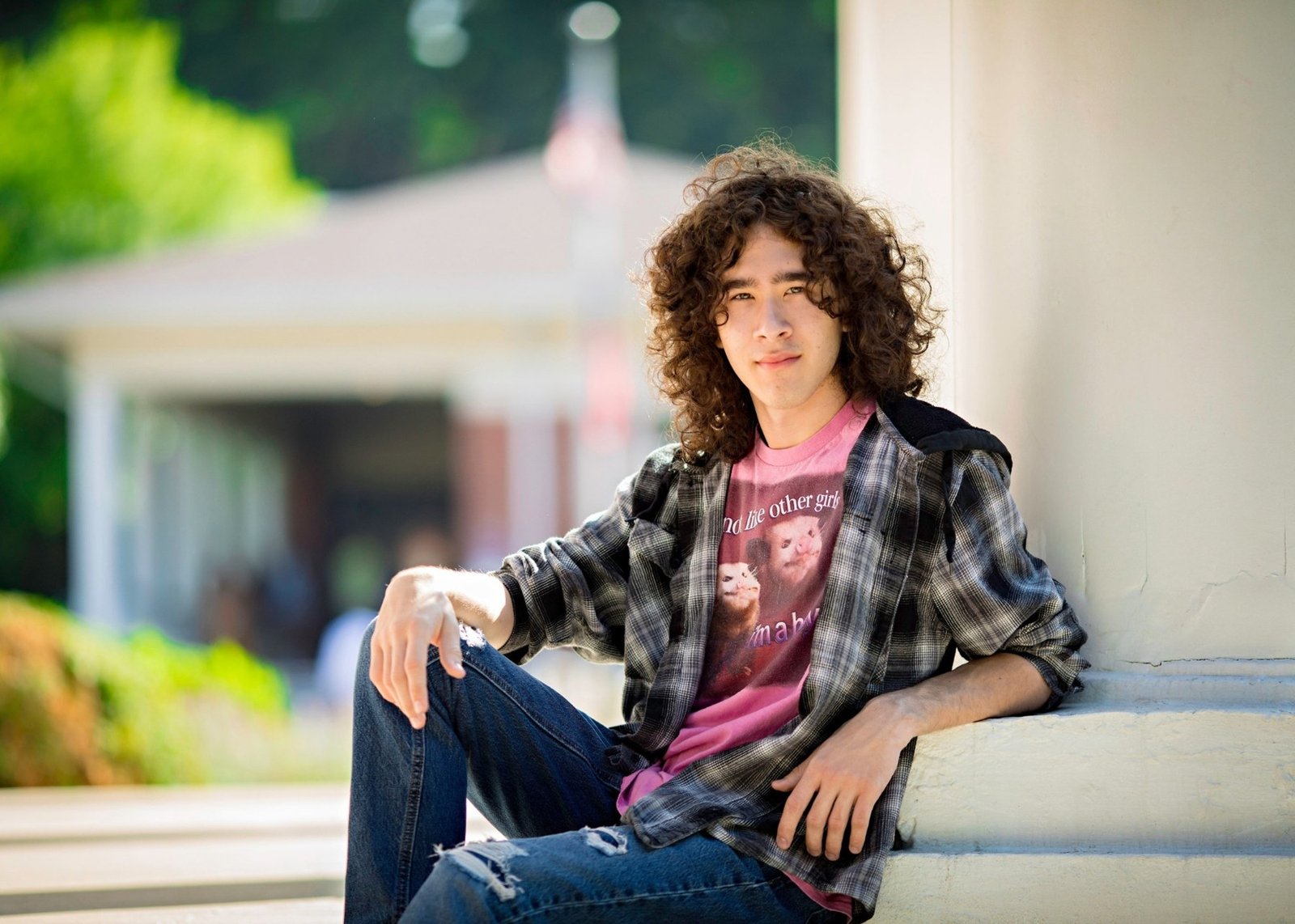 Portrait of Milo Powers seated outdoors